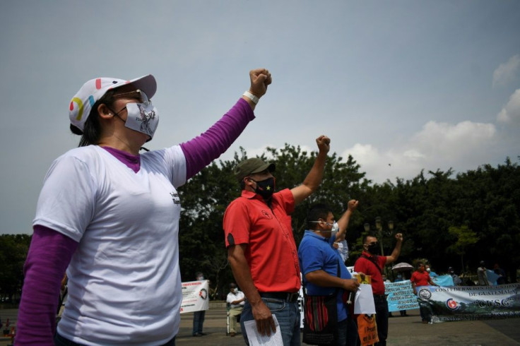 Workers wear face masks during a May Day protest in Guatemala City