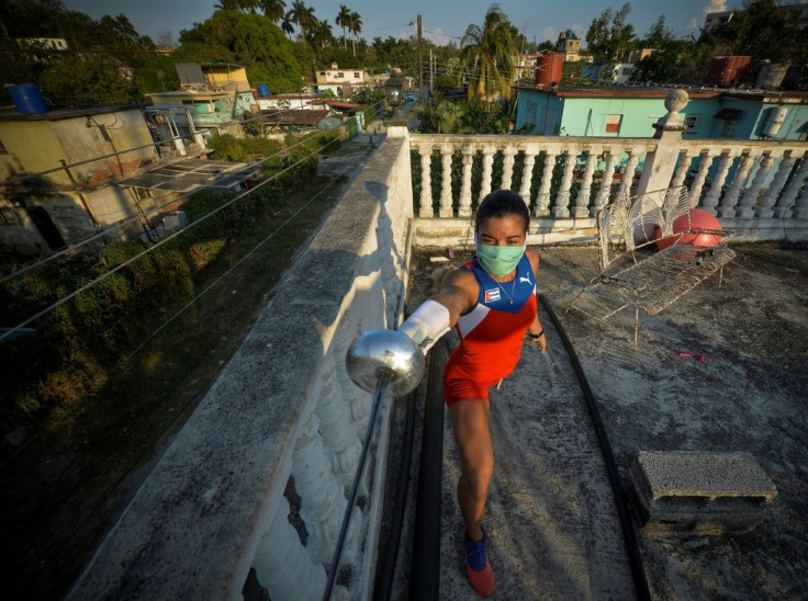 Cuban modern pentathlete Leydi Laura Moya gets some fencing practice in on the rooftop of her Havana home