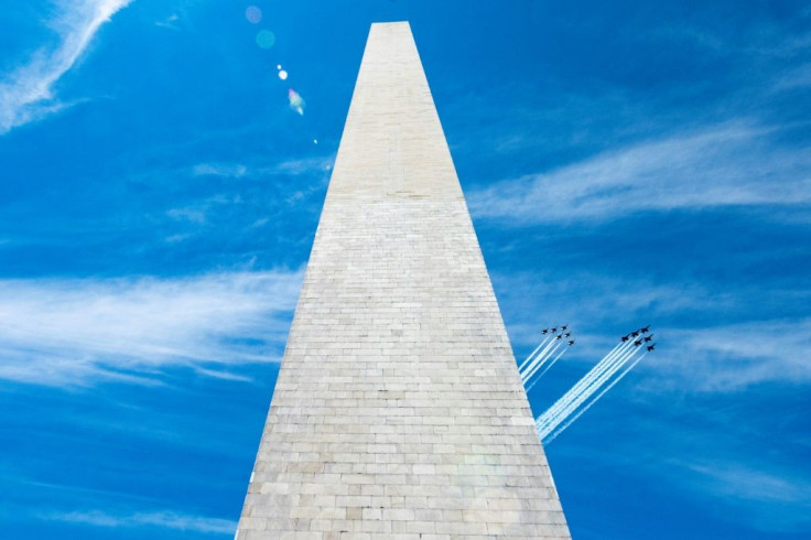 The US Navy Blue Angels (R) and US Air Force Thunderbirds fly past the Washington Monument on May 2, 2020, in a tribute to frontline workers during the coronavirus pandemic