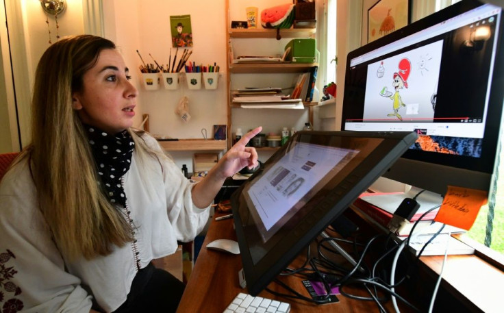 Artist Reem Ali Adeeb gestures while pointing out the Netflix production of "Green Eggs and Ham" on which she worked, in her studio apartment in Los Angeles, California on April 29, 2020