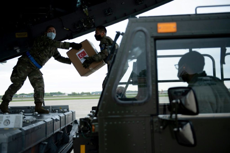 A Turkish military cargo plane with medical supplies and protective equipment to help the US response to COVID-19 is unloaded at Andrews Air Force Base near Washington in April 2020