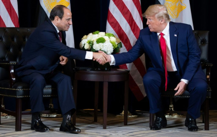 President Donald Trump shakes hands during a 2019 meeting with Egyptian President Abdel Fattah el-Sisi, who has sent coronavirus aid to the United States, itself a major donor to Cairo