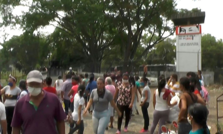 A screengrab shows inmates' relatives reacting outside Los Llanos prison in Guanare on May 2