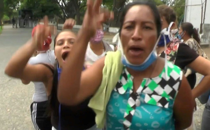 A screengrab shows inmates' relatives reacting outside Los Llanos prison in Guanare on May 2