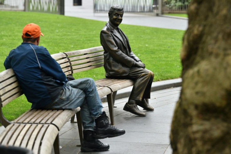 A statue of comedian Rowan Atkinson in London's Leicester Square. Britain remains under lockdown