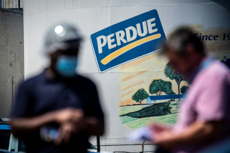 A recently recruited employee who wants to stay anonymous outside the Perdue Farms Chicken and poultry processing factory in Salibury, Maryland, where Haitian workers are fearful of catching the coronavirus at work