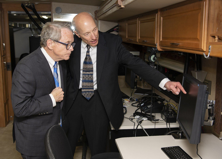 Arthur_Huber_shows_Mike_DeWine_one_of_the_monitors_in_the_SkyVision_recreational_vehicle