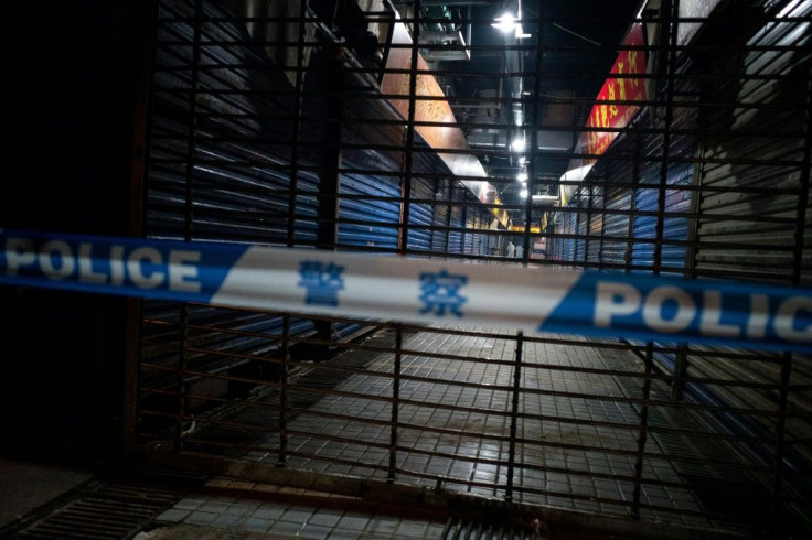 A Hygiene Emergency Response Team searches the closed Huanan Seafood Wholesale Market in Wuhan in January