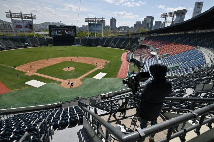 The scene at a fan-free pre-season game between Seoul-based Doosan Bears and LG Twins last month. The regular season begins Tuesday