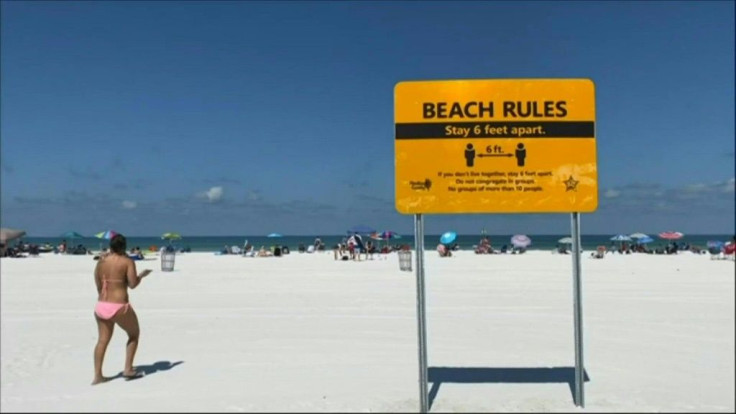 Tampa Bay residents head to Clearwater Beach to soak up the sun on Pinellas County's first day of reopening as Florida slowly starts lifting stay-at-home orders.