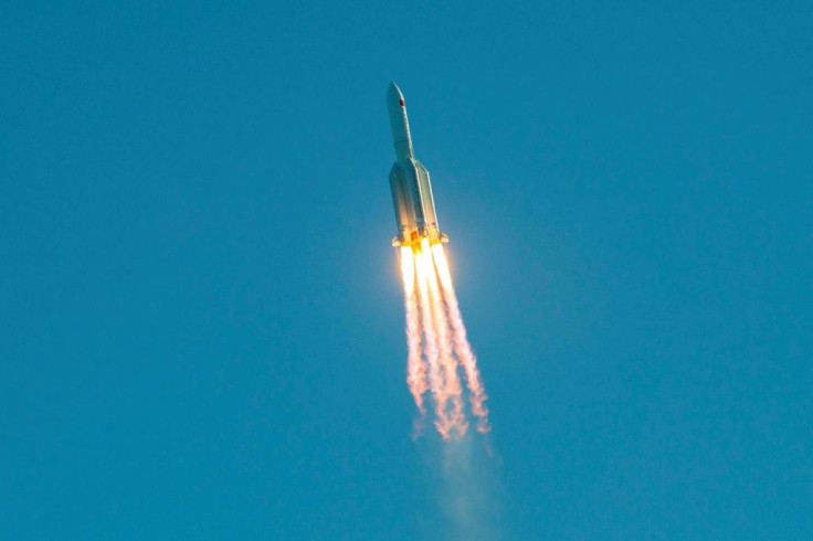 The Long March 5B rocket took off from the southern island of Hainan and eight minutes later an unmanned prototype spaceship successfully separated and entered its planned orbit, according to state media