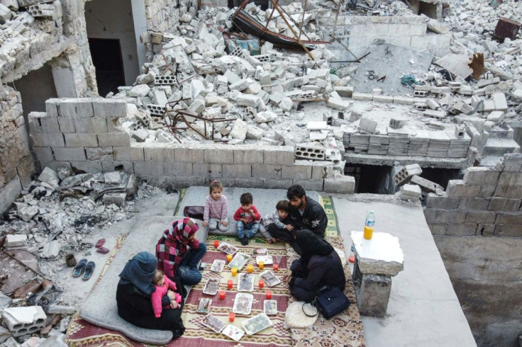 Tareq Abu Ziad and his family had to flee their hometown of Ariha as Syrian regime forces closed in -- but they returned to their destroyed home for a Ramadan meal