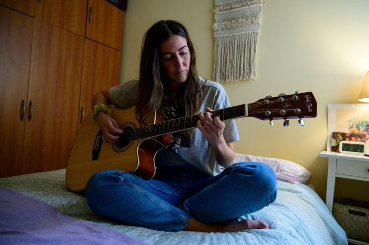 Cristina Rios says online guitar courses are a welcome distraction. The flatmates share music, meals and dancing to support each other through difficult times during the pandemic