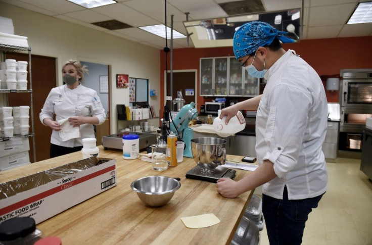 Pastry chef Christine Giegerich and another PastryStar employee work in a test kitchen