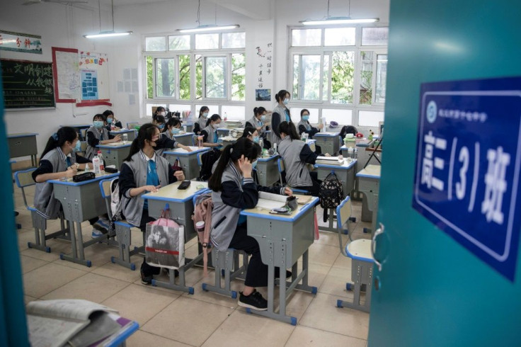 Senior school students returned to class in the central Chinese city of Wuhan, where the coronavirus that has now swept the globe first emerged late last year