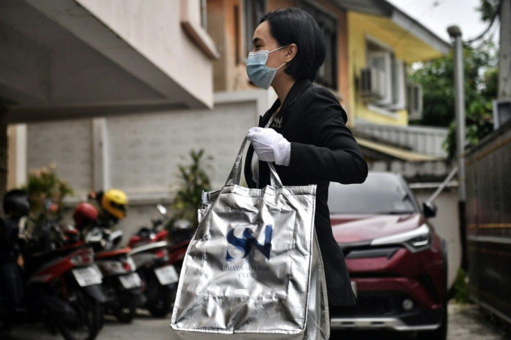 Gourmet take-out delivered by a butler in a black sedan -- Thailand's super-rich have not forgone luxury during a pandemic