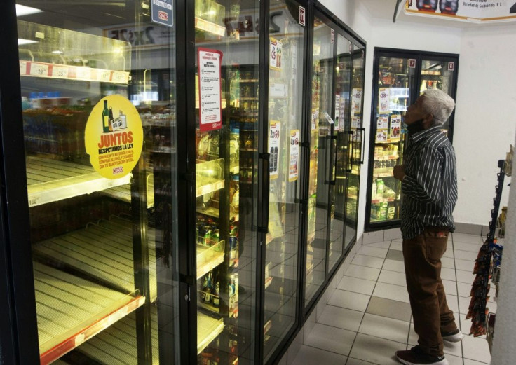 A man looks for a soda after no beer was available in Monterrey, Mexico on May 5