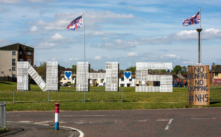 Wooden Pallets spelling out NHS, to show support and thanks for the National Health Service, are pictured in the Loyalist area of Portadown, east Belfast.