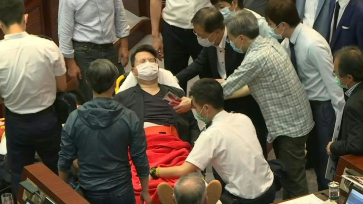 IMAGES Rival Hong Kong lawmakers clash inside the city's legislature, raising political tensions weeks after Beijing sparked a constitutional row by calling for filibustering opposition politicians to be removed from office.