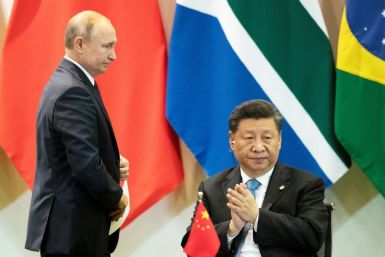 China's President Xi Jinping and Russia's President Vladimir Putin attend a summit of the BRICS major emerging economies in Brasilia in November 2019