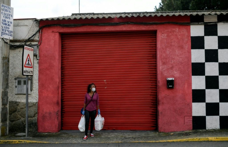 Evelyn Rochel lives in a room inside a Madrid hostess club and pays 2,100 euros per month for "the right to work" as a prostitute