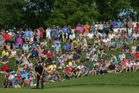 Fans look on as Patrick Cantlay putts in the final round on the way to victory in the 2019 US PGA Tour Memorial Tournament