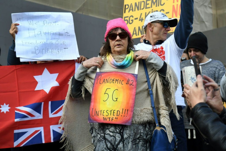 About 150 protesters rallied outside Victoria's state parliament to protest against a shutdown aimed at stemming the spread of COVID-19, while also peddling conspiracy theories about the virus