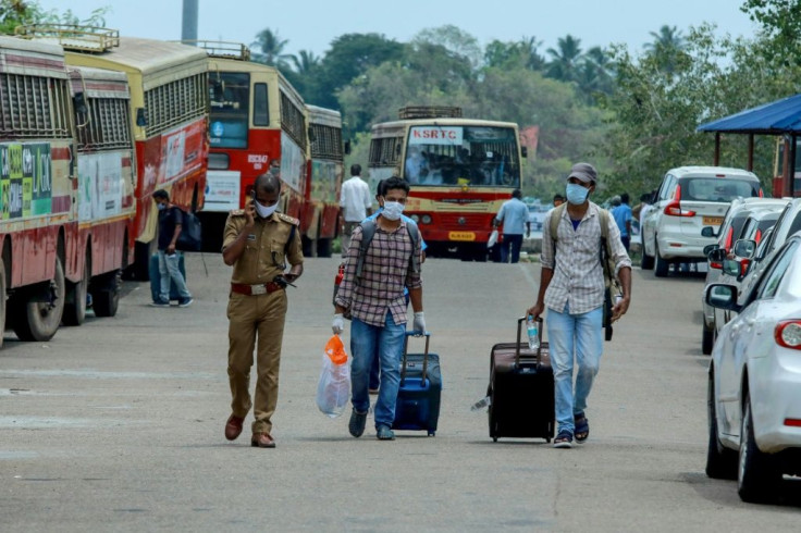 A navy ship carrying almost 700 evacuees arrived in India as part of a massive effort to bring home hundreds of thousands of nationals stranded overseas