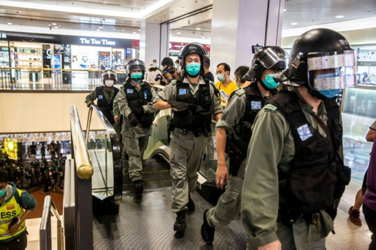 Small flashmob demonstrations broke out in at least eight malls, prompting riot police to rush in and disperse heckling crowds of activists and shoppers