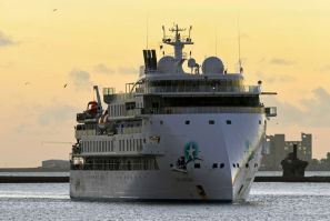 Coronavirus-hit cruise liner, the Greg Mortimer, arrives in the port of Montevideo after the government of Uruguay allowed it to disembark passengers on April 10, 2020