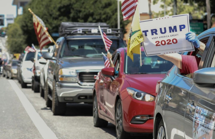 A protestor displays a Trump sign during a demonstration in Los Angeles