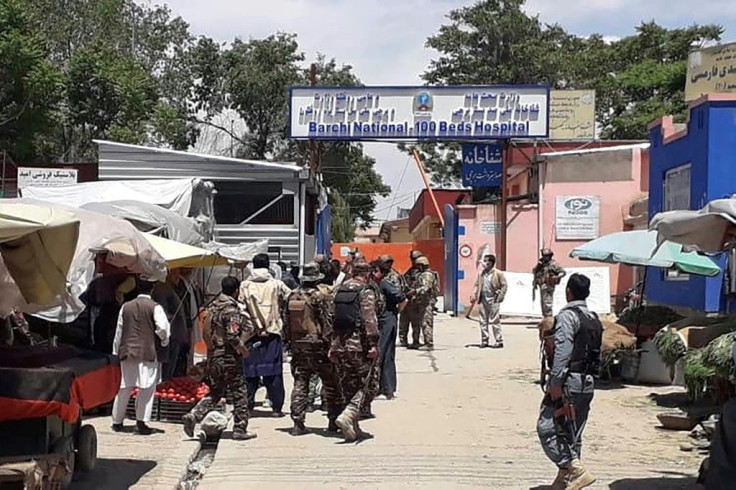 Afghan security personnel arrive at the site of an attack outside a hospital in Kabul on May 12, 2020