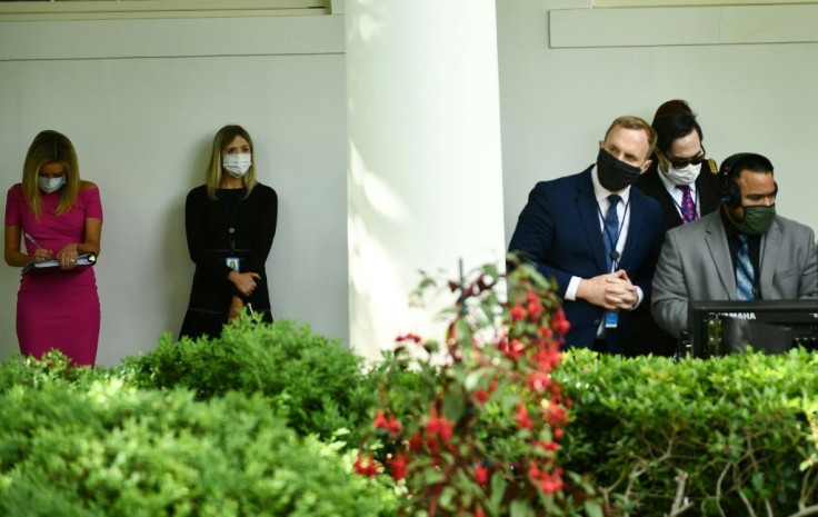 The virus appeared to have gained a foothold in the White House over the weekend, with staff told they had to wear masks at work