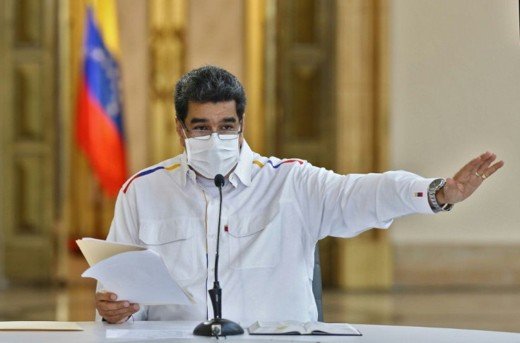 Venezuelan President Nicolas Maduro reads a televised message on May 9, 2020