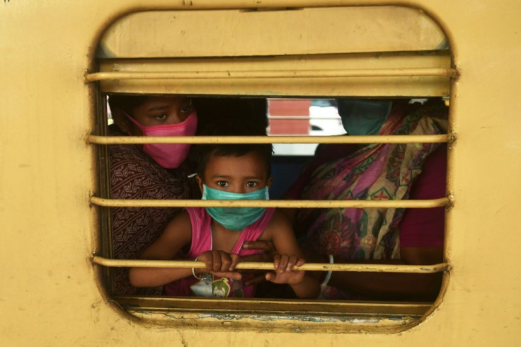 Patients and their relatives arrive in Kolkata from the southern Indian city of Vellore after the government eased its nationwide lockdown