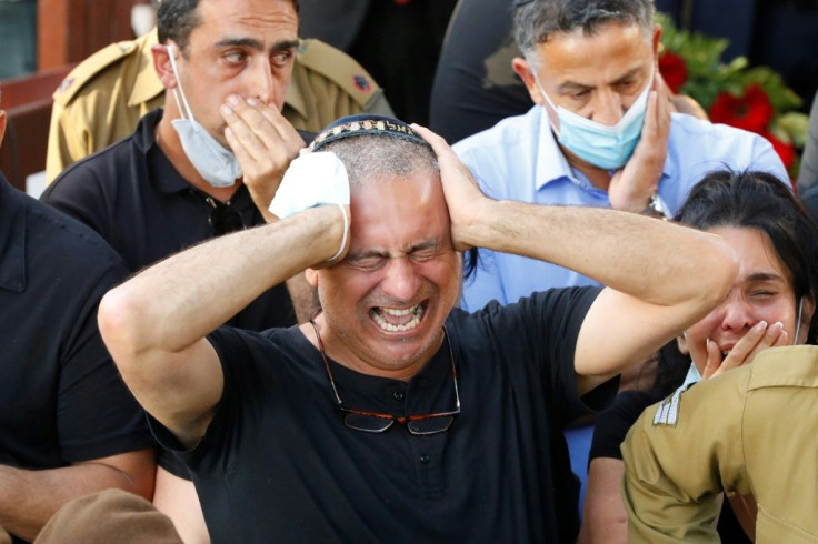 Family members and friends mourn during the funeral of Amit Ben Ygal, a 21-year-old Israeli army soldier who was killed in the village of Yaabed near the West Bank city of Jenin