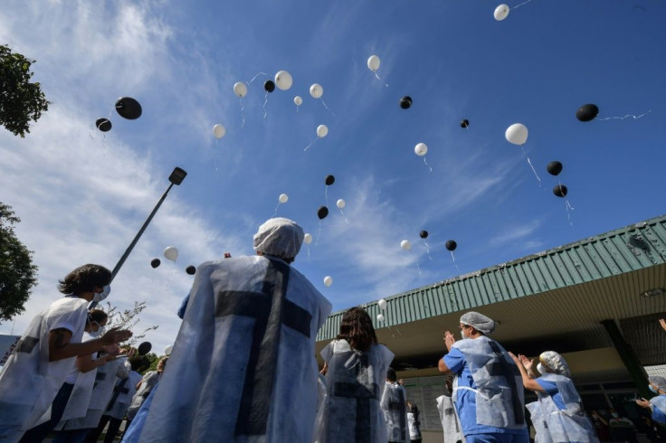 Health workers in Brazil honour colleagues who have died of the novel coronavirus