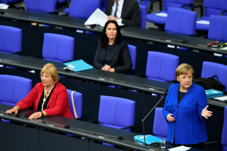 German Chancellor Angela Merkel addresses the socially-distanced members of the Bundestag
