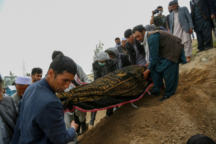 Mourners prepare to bury a victim of the May 12, 2020 suicide attack on a maternity hospital in Kabul