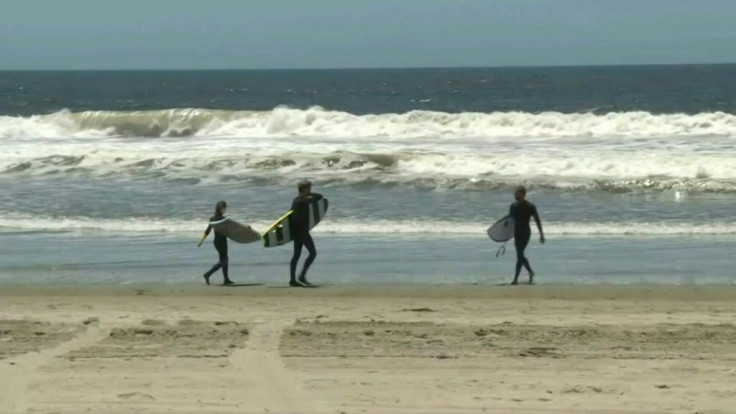 IMAGES Footage of Venice Beach as Los Angeles County beaches reopen for activities including swimming, surfing, running and walking, while sunbathing or picnicking are forbidden amid the coronavirus pandemic.