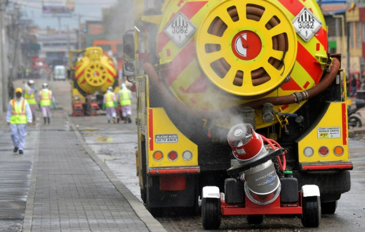 A truck disinfects the streets, as a preventive measure against the spread of the novel coronavirus, COVID-19,  in Bogota, Colombia