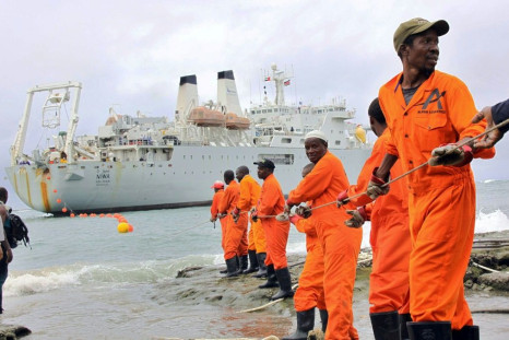 Workers at the Kenyan port of Mombasa haul ashore a fibre optic cable in June 2009 as part of a scheme to boost internet connectivity in East Africa