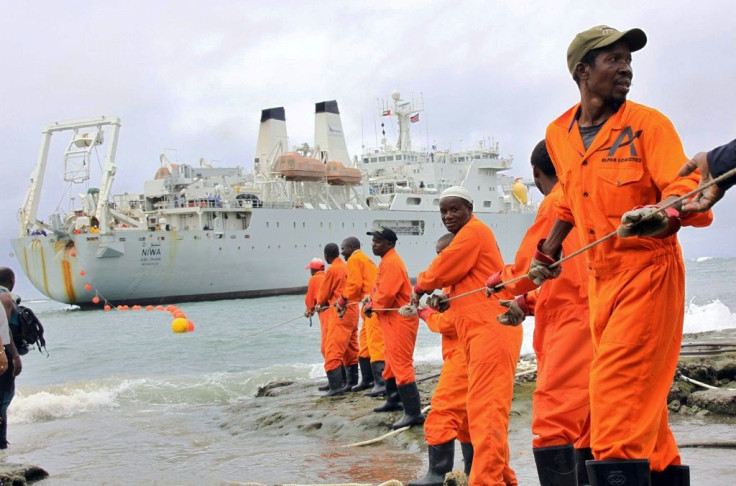 Workers at the Kenyan port of Mombasa haul ashore a fibre optic cable in June 2009 as part of a scheme to boost internet connectivity in East Africa