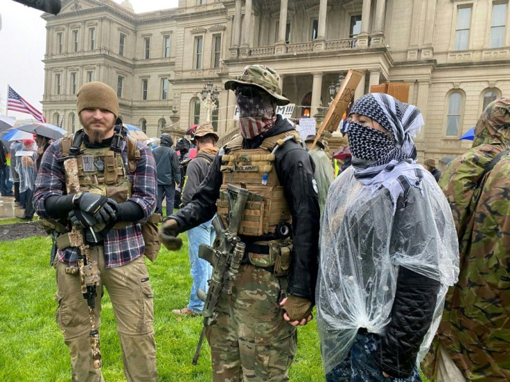 Armed demonstrators protest stay-at-home orders in Lansing, Michigan on May 14, 2020