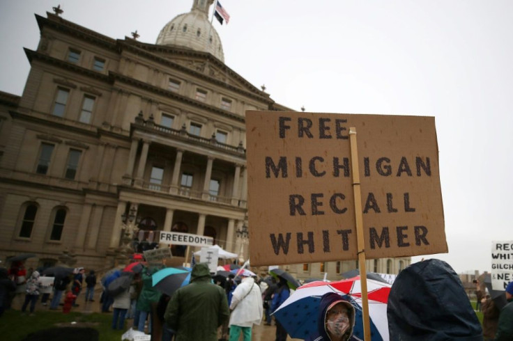 A sign calling for the recall of Michigan Governor Gretchen Whitmer at an anti-lockdown protest in Lansing, Michigan