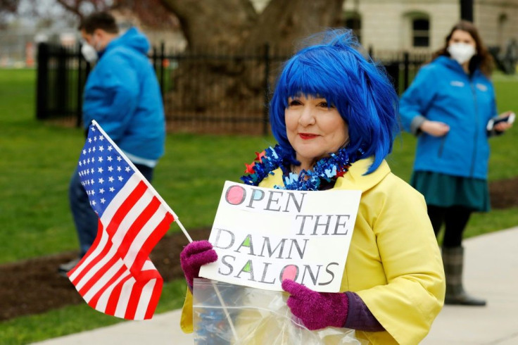 Christina Wolford joins demonstrators protesting against the coronavirus lockdown in Lansing, Michigan