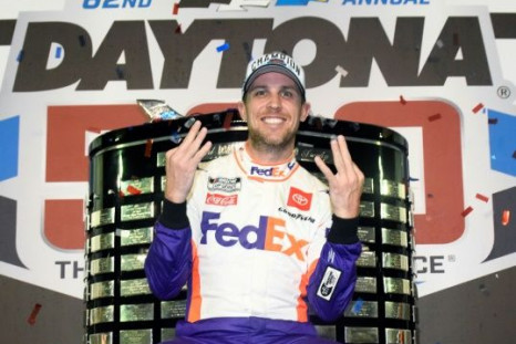 Denny Hamlin poses with the championship trophy after winning NASCAR's biggest race, the Daytona 500, in February at the famed Florida racetrack
