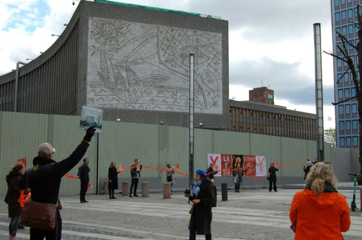 Activists form a human chain during a demonstration in a last-ditch effort to try to save Y block