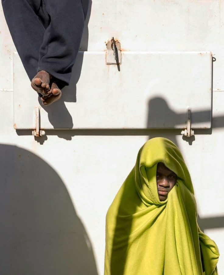 Two migrants are pictured on board the Aita Mari vessel in February after their rescue in international waters