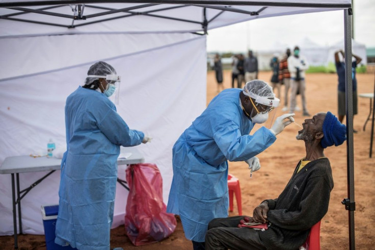 An elderly man, a resident of the sprawling township of Alexandra in Johannesburg, is tested for COVID-19